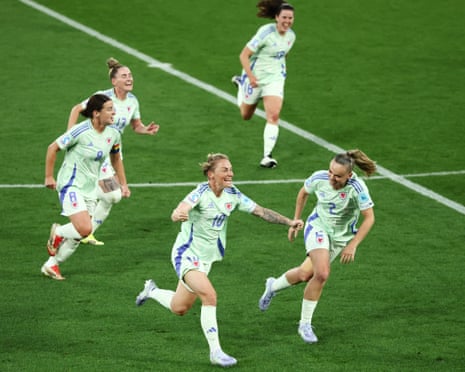 Wales’ Jessica Fishlock celebrates scoring their equaliser with Lily Woodham and their teammates.