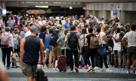 People gather while waiting for flights at the Kahului airport.