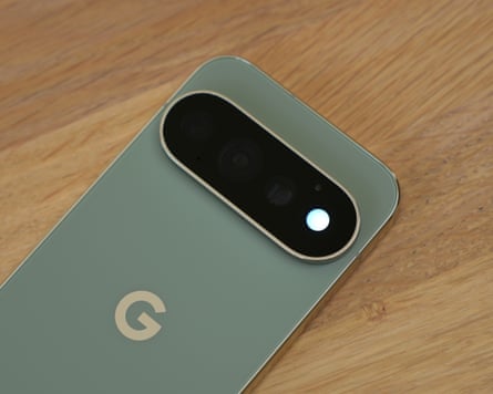 The HiLight LED on the back of the Google Pixel 11 Pro lit to indicate Gemini is active and listening.