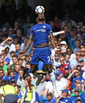 Chelsea’s Antonio Rudiger leaps with Everton’s Wayne Rooney and feels the pain of the clash as Chelsea beat Everton 2-0 at Stamford Bridge.