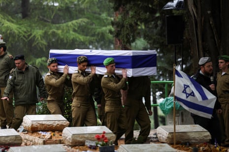 Israeli soldiers carry the casket of Israeli military reservist sergeant first class Nicholas Berger, who was killed in the southern Gaza Strip, at his funeral at the Mount Herzl military cemetery in Jerusalem on Wednesday.