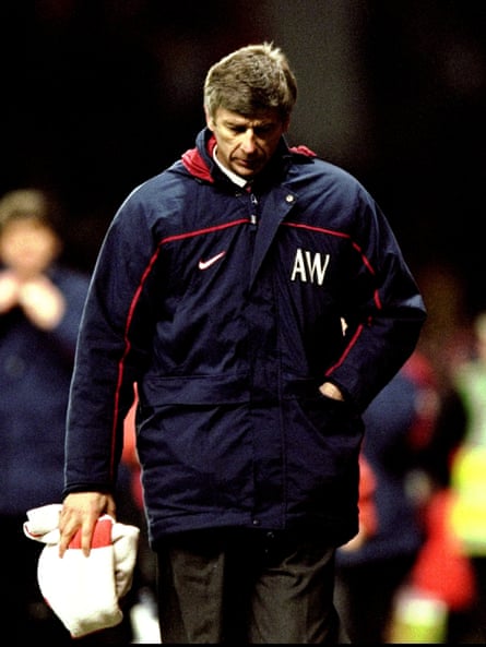 A disappointed Arsène Wenger trudges off after defeat.