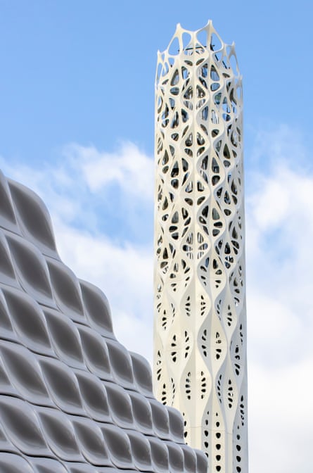 The lattice-like Tower of Light, rising from a Wall of Energy made from undulating ceramic tiles.