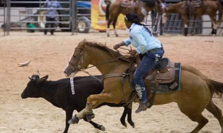 A cowgirl competes in the Ladies Steer Undecorating