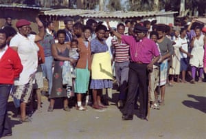 1990: Tutu greets residents of Phola park squatter camp during a visit in Tokoza