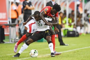 Ghana’s Frank Acheampong shields the ball from Uganda’s Moses Oloya.