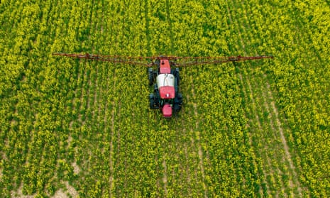 A farmer spreads pesticide on a field in Centreville, Maryland, in April.