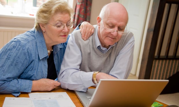 Mature couple using the internet on a laptop