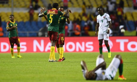 Cameroon celebrate their first Africa Cup of Nations victory for seven years while the next to Guinea-Bissau players despair at a missed opportunity for a famous upset.