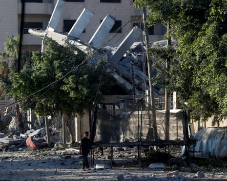 A Palestinian boy stands at the site of an Israeli airstrike on a house that was hit on Wednesday, in Gaza City, June 26, 2025.