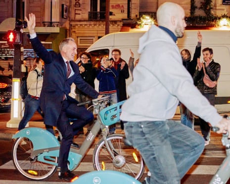 Socialistes et Apparentes’ MP and Paris mayoral candidate Emmanuel Gregoire rides a Velib’ public bike-sharing bicycle to Paris town hall after his victory.