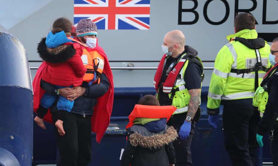 A group of people thought to be migrants are brought in to Dover, Kent by Border Force officers on Saturday following a small boat incident in the Channel.