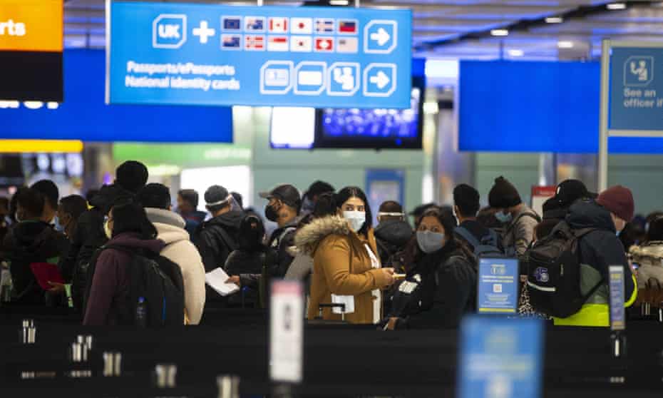 Passengers queue at Heathrow airport