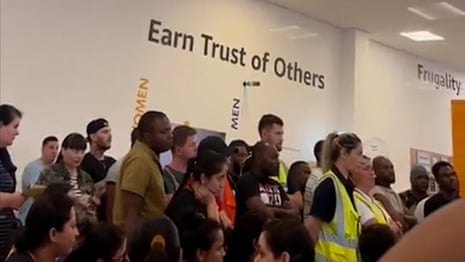 Hundreds of Amazon employees stop working over disputed pay rise – video