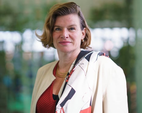 Mazzucato in a cream blazer and patterned scarf