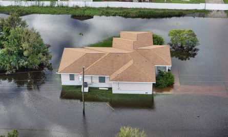 Flood water surrounds a home