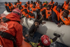 Refugees and migrants are rescued by aid workers of the Spanish NGO Proactiva Open Arms, after leaving Libya aboard an overcrowded rubber boat.