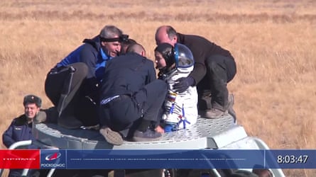Yulia Peresild is assisted out of the Soyuz capsule after returning from the International Space Station on Sunday.