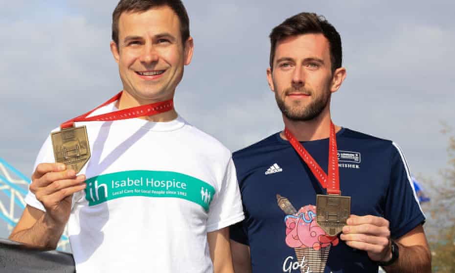David Wyeth of Chorlton Runners with Swansea Harrier Matthew Rees, who helped Wyeth to the finishing line of the London Marathon on Sunday.