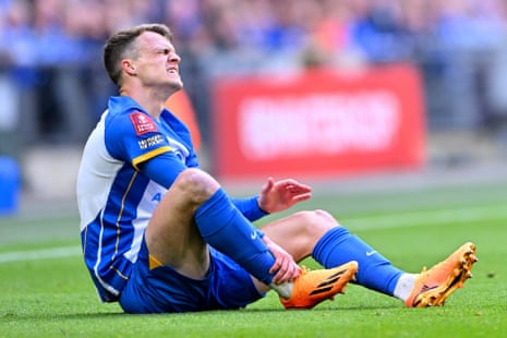 Solly March of Brighton and Hove Albion is injured.