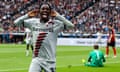 Leverkusen's Jeremie Frimpong celebrates after adding his side’s fourth goal in Frankfurt