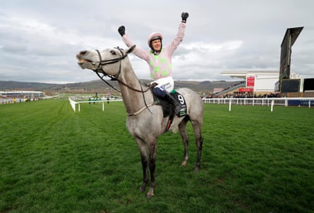 Paul Townend raises his arms in the air as he celebrates victory on Lossiemouth in the Champion Hurdle.