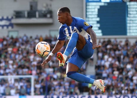 Brighton ‘s Pervis Estupinan acrobatically controls the ball against West Ham United.