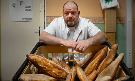Stephane Ravacley with a basket of baguettes