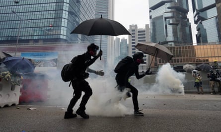 Protesters running for cover from teargas during the demonstrations yesterday.