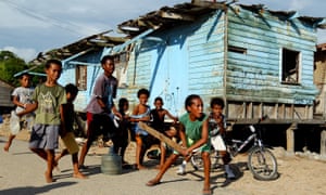 Children from the village of Hanuabada play cricket in the streets, in Port Moresby, Papua New Guinea – a country where the UN report highlighted problems, particularly with access to safe sanitation.