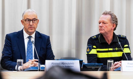 Ahmed Aboutaleb and Fred Westerbeke sit next to each other in front of microphones