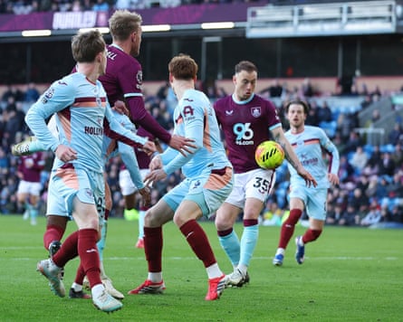 Burnley's Ashley Barnes appears to handle the ball before scoring his side’s disallowed fourth goal against Brentford