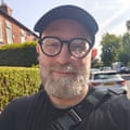a man in a hat and glasses