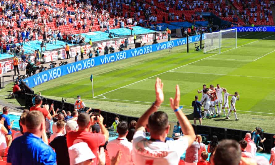 Fans celebrate at Wembley after Raheem Sterling scores for England against Croatia