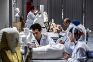 Technicians craft replicas of statues and sarcophagi at the Konouz factory