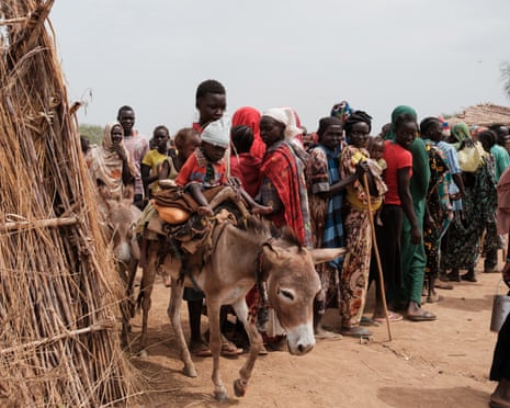 File shot of people queuing to register for aid at an internally displaced persons’ camp in North Kordofan state