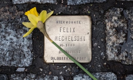 A flower laid on an individual Stolperstein in Berlin.