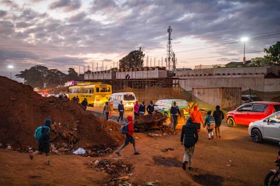 Children walk to school along the construction of the Expressway in August in Nairobi