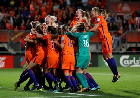 The Dutch players celebrate after the third goal.