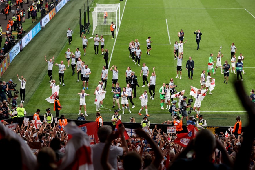 Players of England celebrate with their fans.