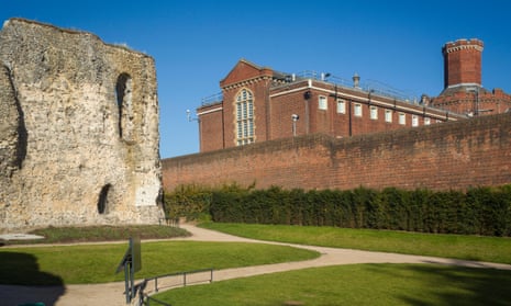 The main Victorian building of Reading prison viewed from the newly restored ruins of Reading Abbey