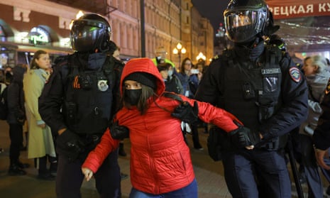 Russian police detain a protester during an unsanctioned rally in Moscow against the mobilisation of reservists ordered by Vladimir Putin.