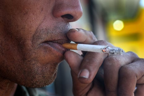 a man smokes a menthol cigarette