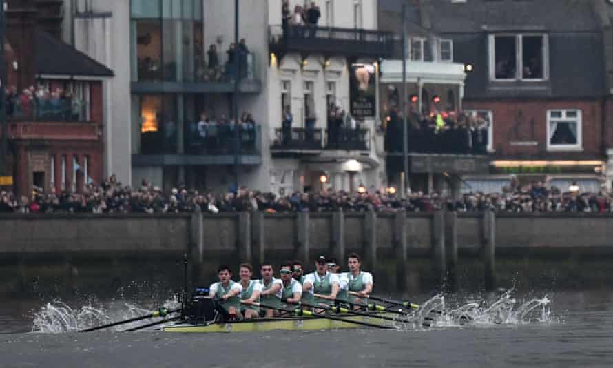 The Cambridge boat, crewed by cox Hugo Ramambason, Freddie Davidson, Rob Hurn, Finn Meeks, Spencer Furey, Dara Alizadeh, James Letten, Patrick Elwood and Charles Fisher approaches the finish line.