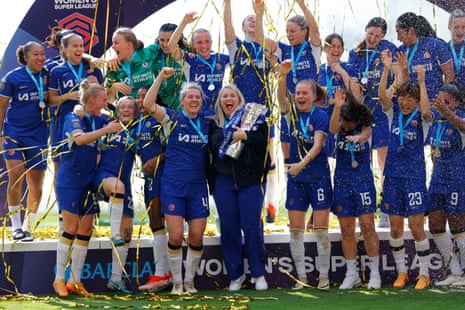 Emma Hayes celebrates with the trophy, Millie Bright and the players.