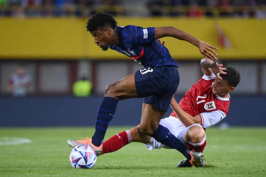 France’s forward Kingsley Coman (L) and Austria’s defender Stefan Lainer vie for the ball.