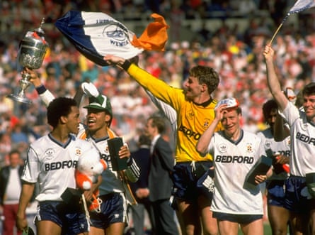 Luton players do a lap of honour around the Wembley pitch.