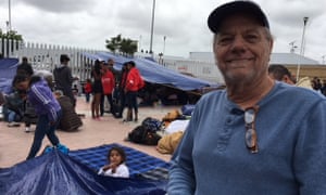 Dennis Tomlinson, a US tourist, at the makeshift migrant camp in Tijuana, Mexico.