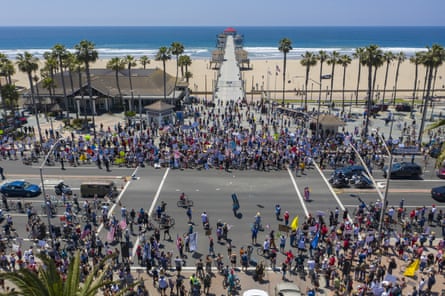 A crowd of protesters calling to reopen businesses and beaches in Huntington Beach, California.