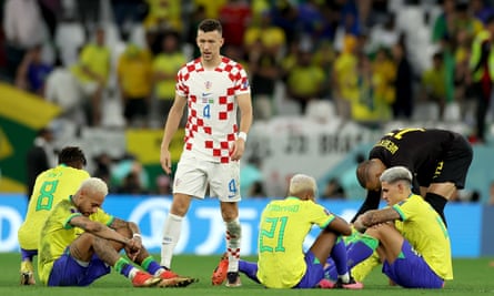 Ivan Perisic goes over to commiserate with the crestfallen Brazilians